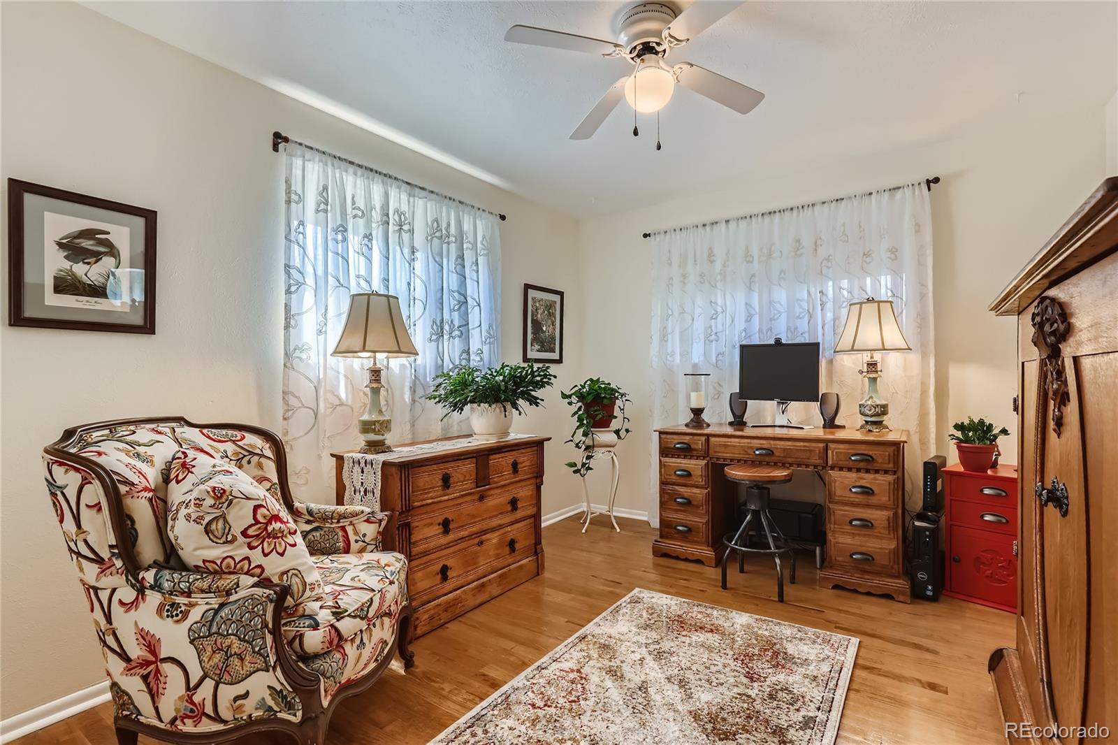 5366 Field Circle Arvada, CO 80002 - Photo 14 of 28 a view of a livingroom with furniture and a flat screen tv