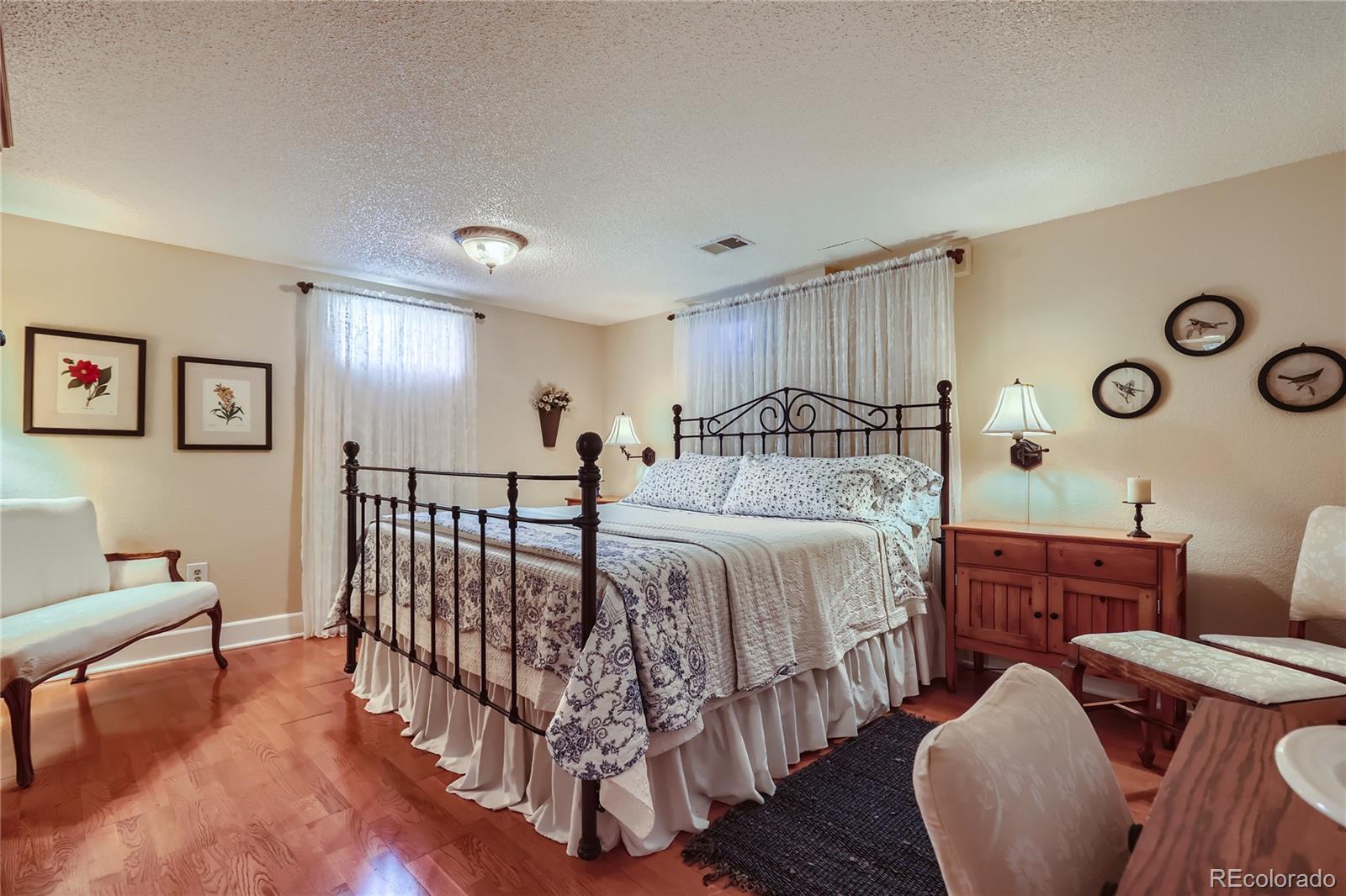 5366 Field Circle Arvada, CO 80002 - Photo 16 of 28 a bedroom with bed and a window