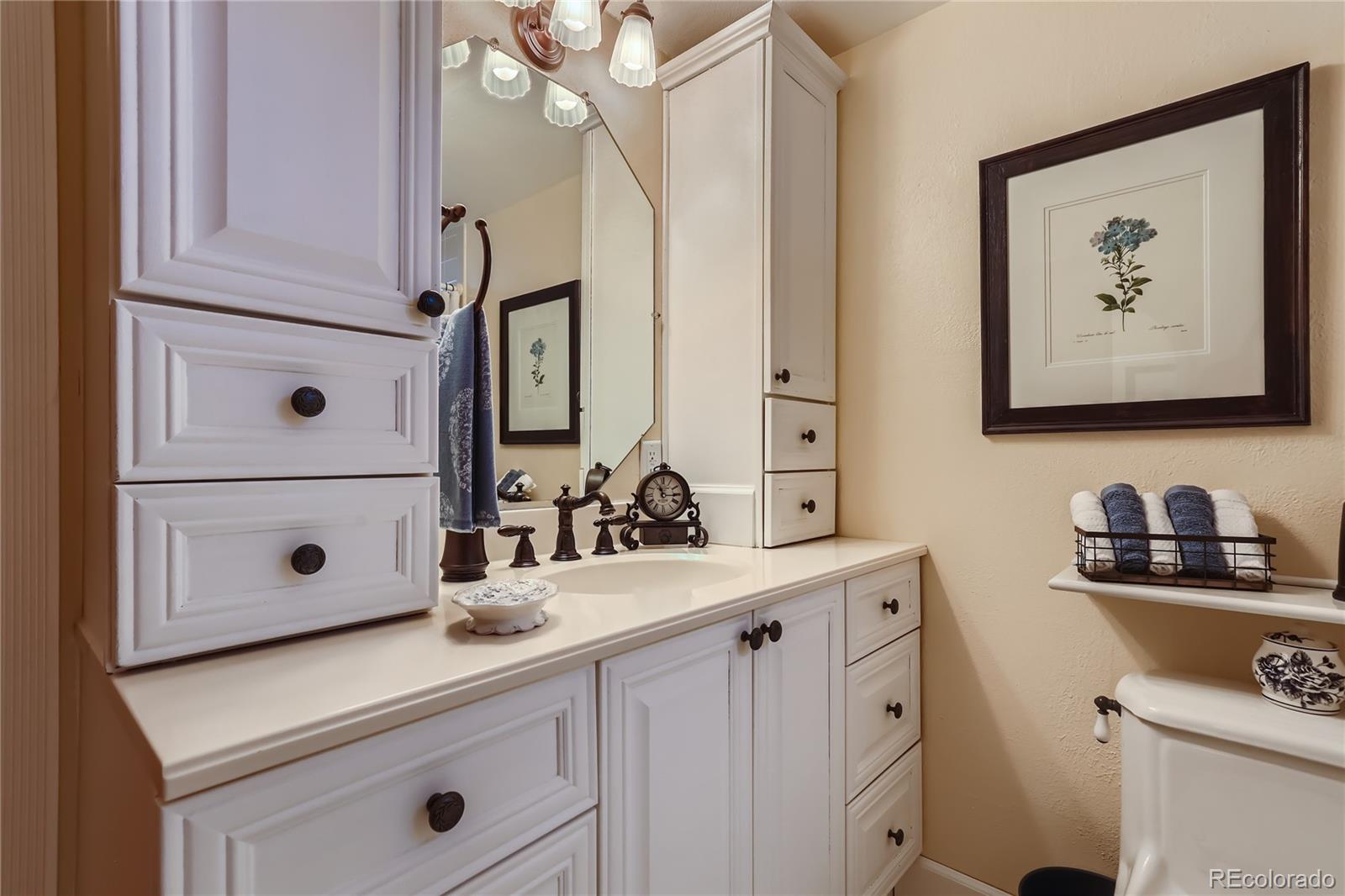 5366 Field Circle Arvada, CO 80002 - Photo 19 of 28 a bathroom with a sink vanity and mirror