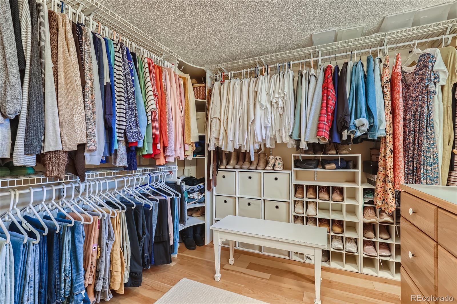 5366 Field Circle Arvada, CO 80002 - Photo 21 of 28 a view of walk in closet with clothes and shoes