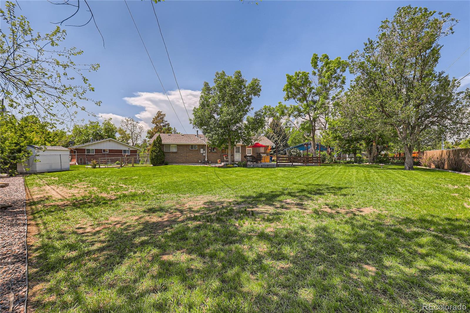 5366 Field Circle Arvada, CO 80002 - Photo 28 of 28 a view of a garden with a building in the background