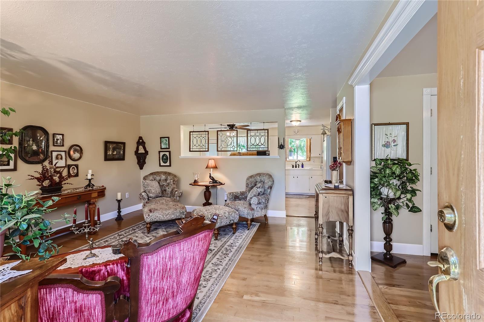 5366 Field Circle Arvada, CO 80002 - Photo 4 of 28 a very nice looking room with many windows and furniture