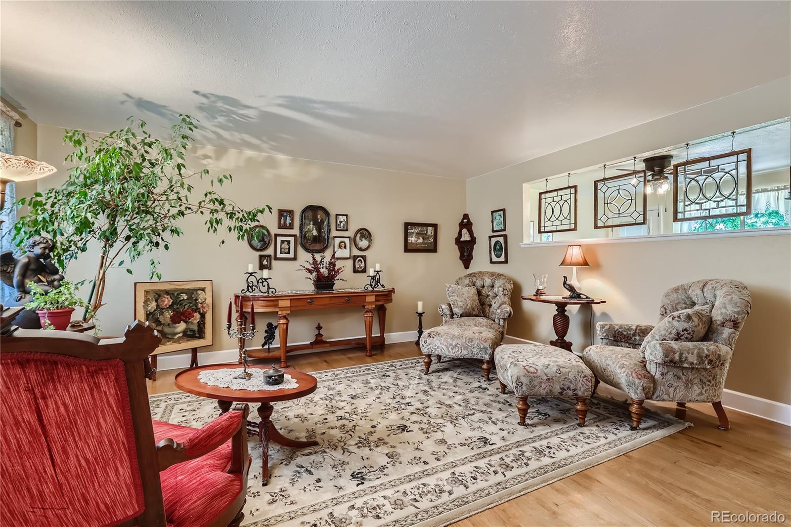 5366 Field Circle Arvada, CO 80002 - Photo 5 of 28 a living room with furniture and wooden floor