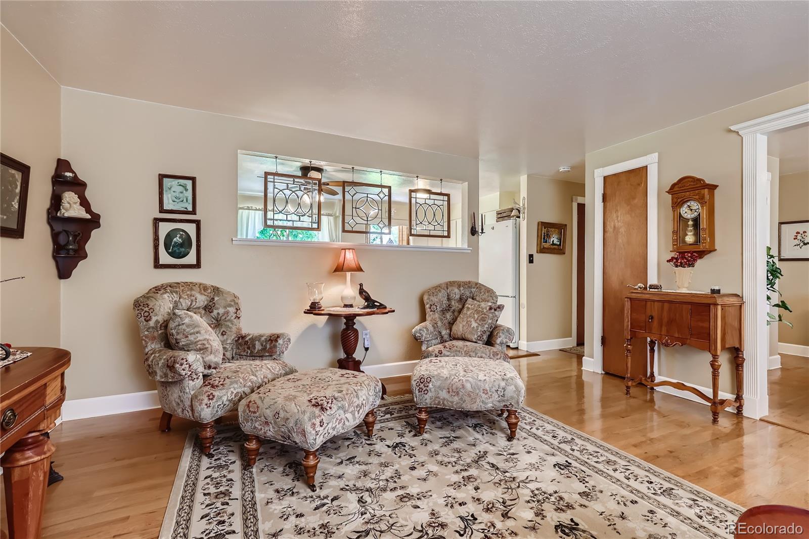 5366 Field Circle Arvada, CO 80002 - Photo 6 of 28 a living room with furniture and wooden floor