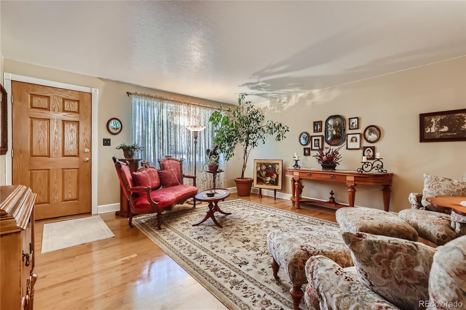 5366 Field Circle Arvada, CO 80002 - Photo 7 of 28 a living room with furniture and wooden floor