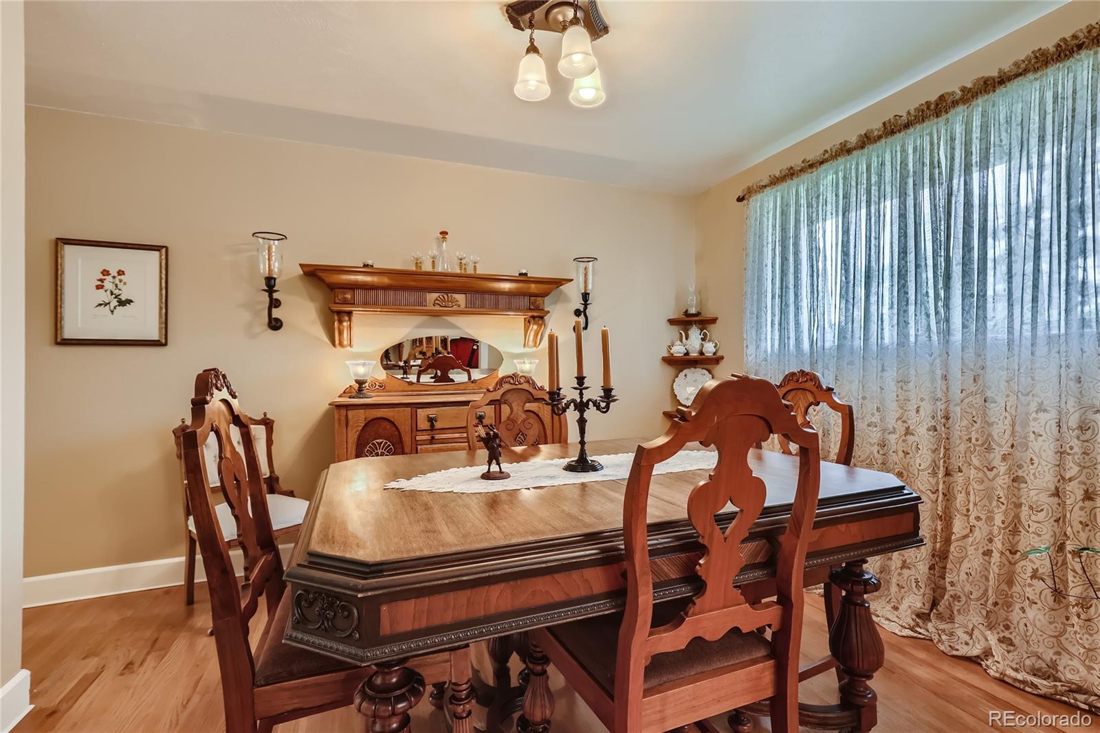 5366 Field Circle Arvada, CO 80002 - Photo 8 of 28 a dining room with furniture and window
