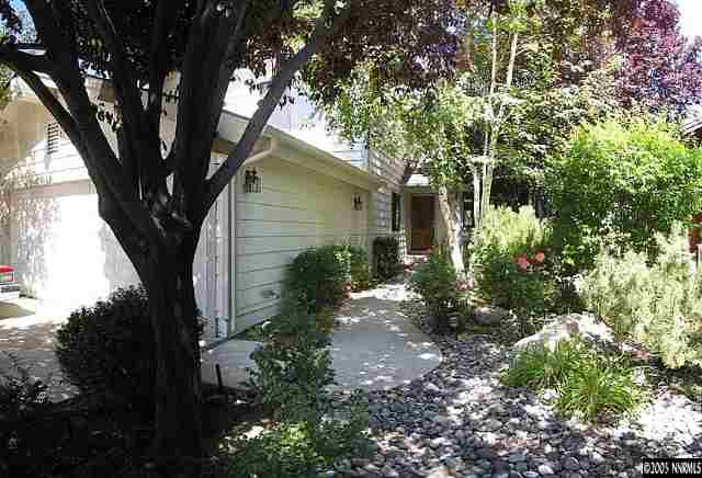 4075 Riverhaven Drive Reno, NV 89519 - Photo 1 of 9 a backyard of a house with lots of green space