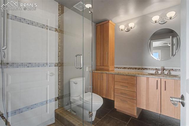 733 Bowstring Road Monument, CO 80132 - Photo 33 of 45 Second lower bath with frameless glass shower