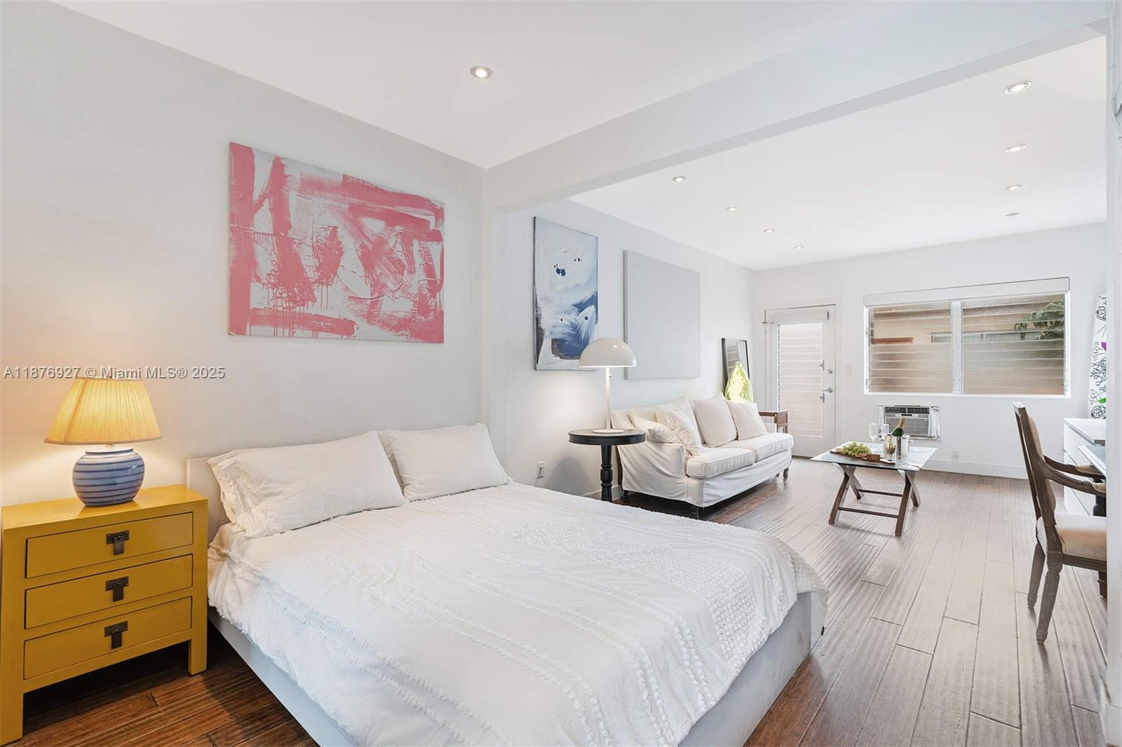 1050 Pennsylvania Avenue, Unit 29 Miami Beach, FL 33139 - Photo 15 of 23 a bedroom with a bed and wooden floor