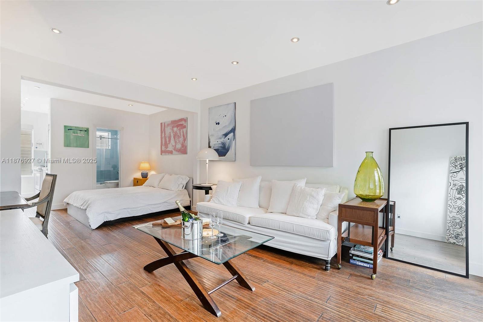 1050 Pennsylvania Avenue, Unit 29 Miami Beach, FL 33139 - Photo 2 of 23 a living room with furniture and a wooden floor