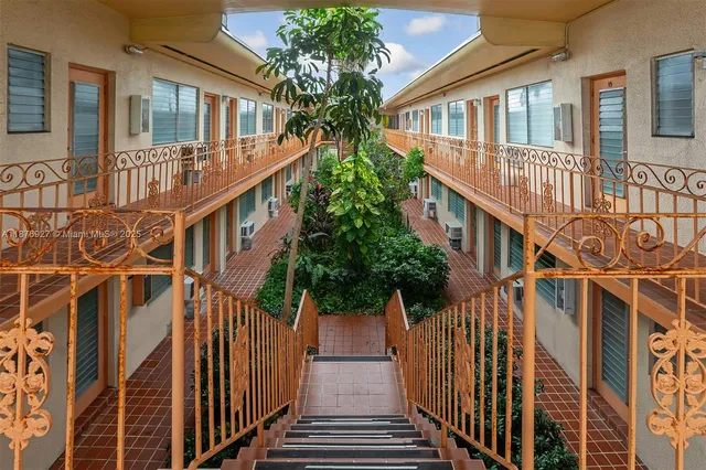 a view of a house with wooden stairs