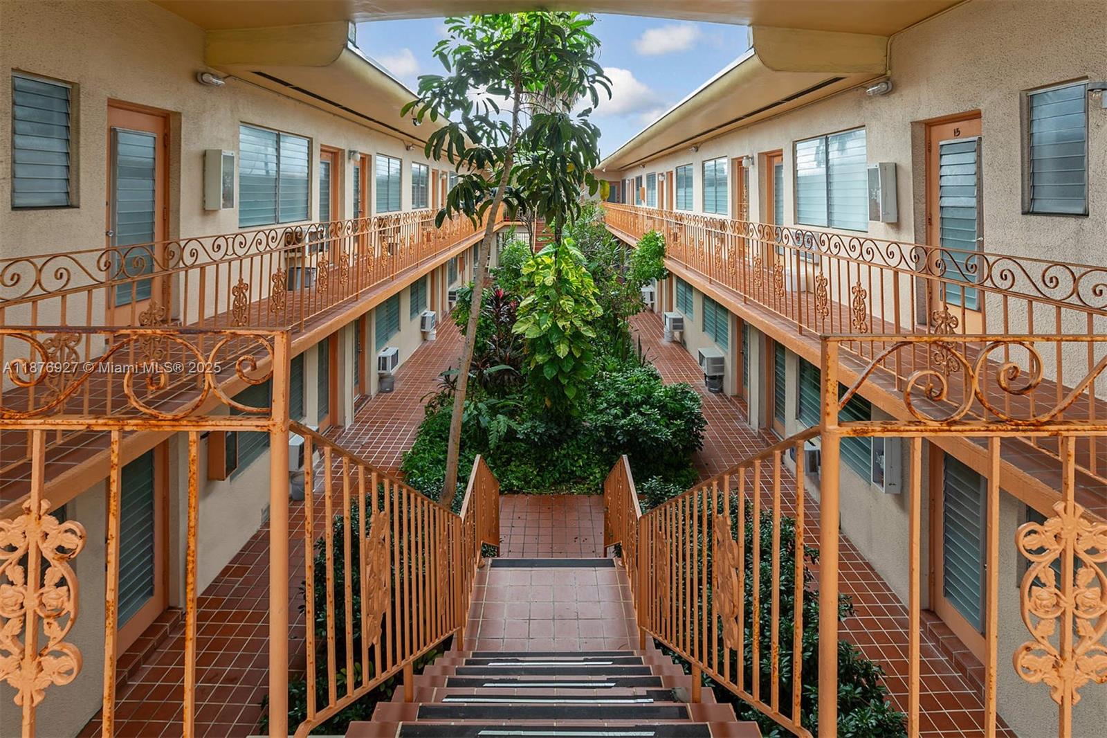 1050 Pennsylvania Avenue, Unit 29 Miami Beach, FL 33139 - Photo 21 of 23 a view of a house with wooden stairs