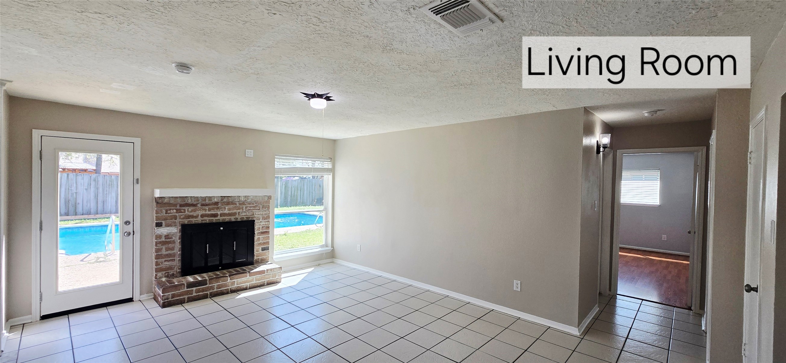 4827 Cypressdale Drive Spring, TX 77388 - Photo 5 of 35 a view of livingroom with an empty space and a fireplace