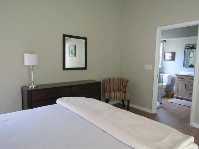 a bedroom with a bed and a table in it