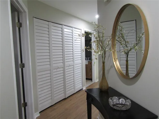 a view of a hallway with washer and dryer
