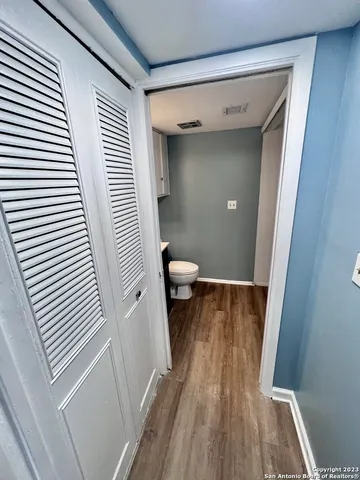 a view of a bathroom from a hallway