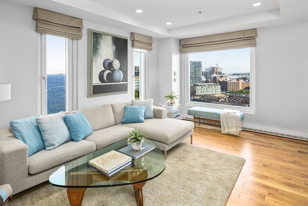 10 Rowes Wharf, Unit PH4 Boston, MA 02110 - Photo 14 of 41 a living room with furniture and a rug