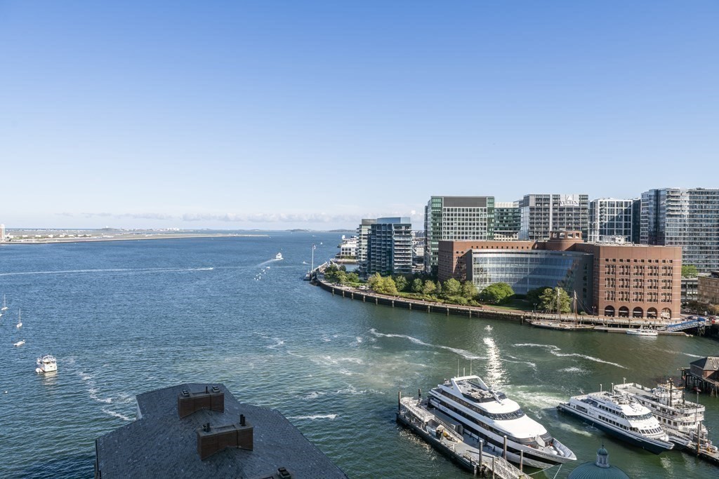 10 Rowes Wharf, Unit PH4 Boston, MA 02110 - Photo 16 of 41 a view of a city with tall buildings