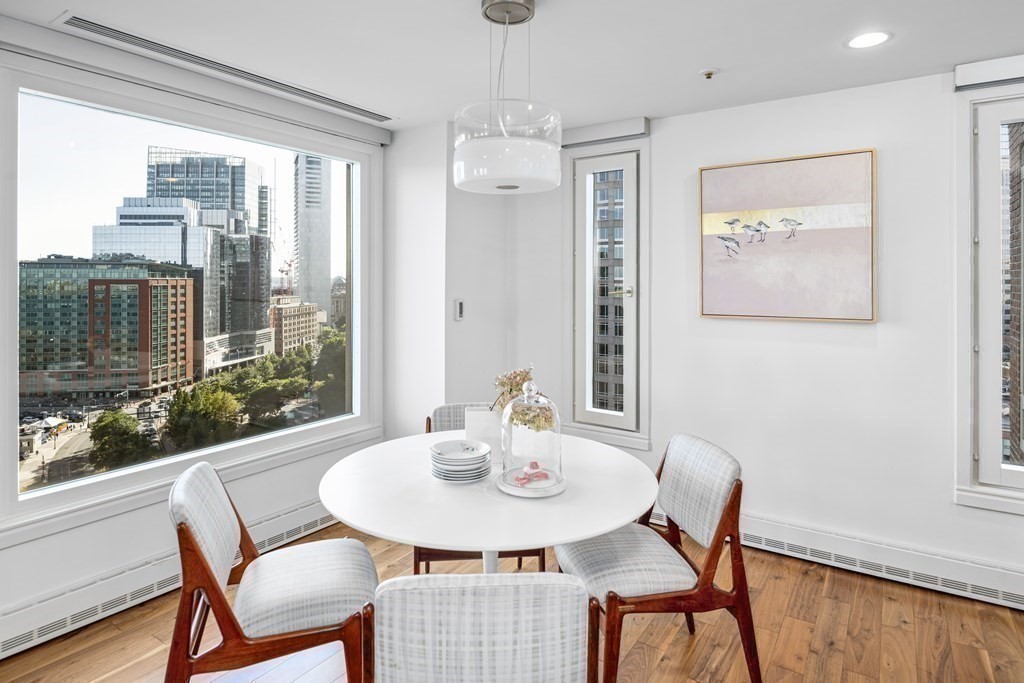 10 Rowes Wharf, Unit PH4 Boston, MA 02110 - Photo 20 of 41 a view of a dining room with furniture window and wooden floor