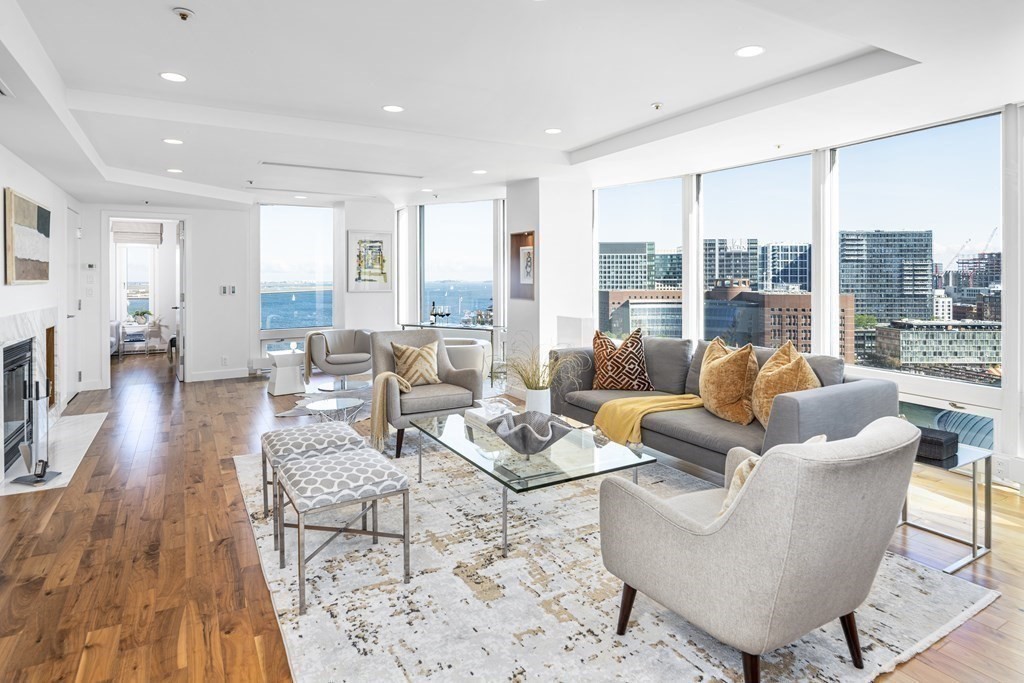 10 Rowes Wharf, Unit PH4 Boston, MA 02110 - Photo 2 of 41 a living room with furniture and a large window