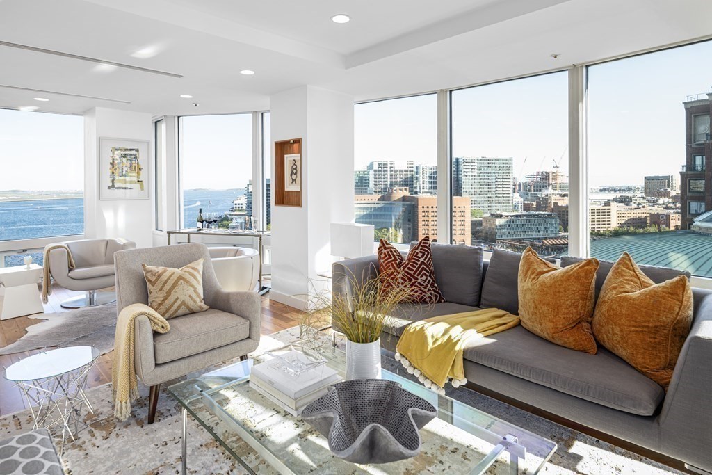 10 Rowes Wharf, Unit PH4 Boston, MA 02110 - Photo 3 of 41 a living room with furniture and a large window