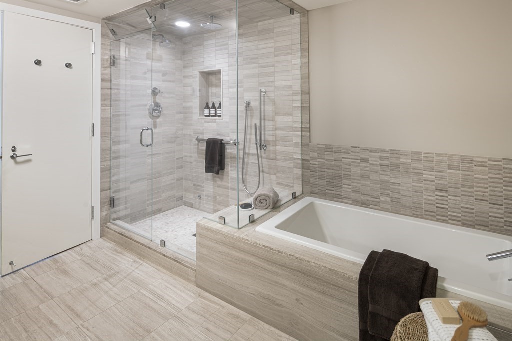 10 Rowes Wharf, Unit PH4 Boston, MA 02110 - Photo 32 of 41 a bathroom with a bathtub and a shower