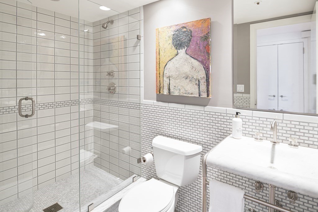 10 Rowes Wharf, Unit PH4 Boston, MA 02110 - Photo 37 of 41 a bathroom with a sink toilet and shower