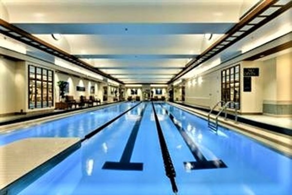 10 Rowes Wharf, Unit PH4 Boston, MA 02110 - Photo 40 of 41 a very nice looking room with wooden floor