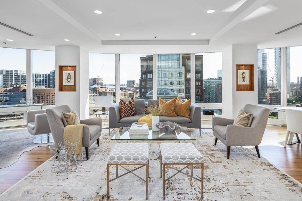 10 Rowes Wharf, Unit PH4 Boston, MA 02110 - Photo 7 of 41 a living room with furniture and a large window