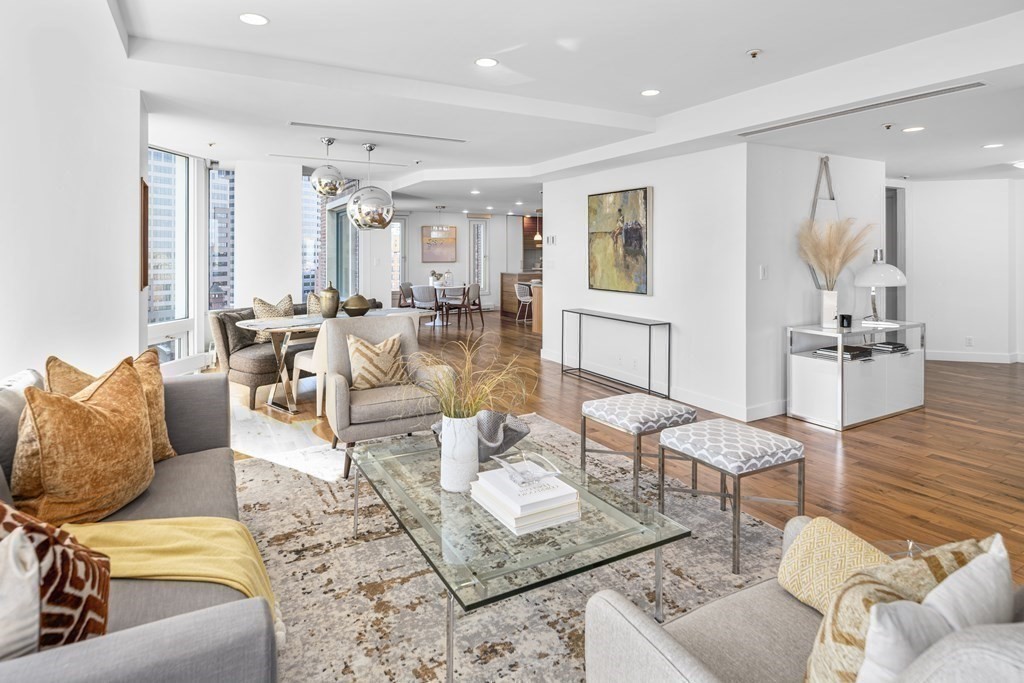 10 Rowes Wharf, Unit PH4 Boston, MA 02110 - Photo 9 of 41 a living room with furniture and wooden floor