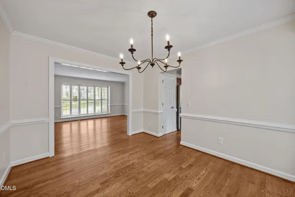 a view of a dining room with furniture and window