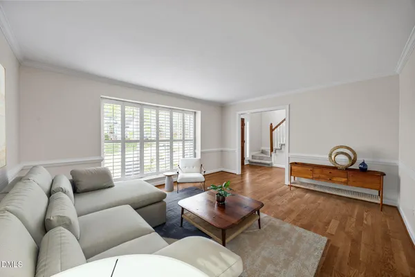 a view of entryway and hall with wooden floor