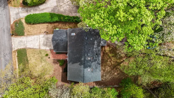 a view of a house with a large window and a yard