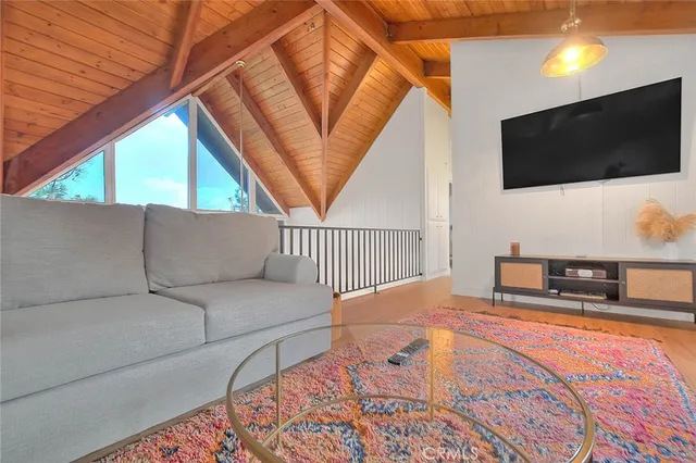 a living room with a flat screen tv and a couch