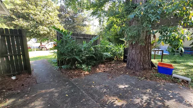 a kitchen with a sink a stove and cabinets