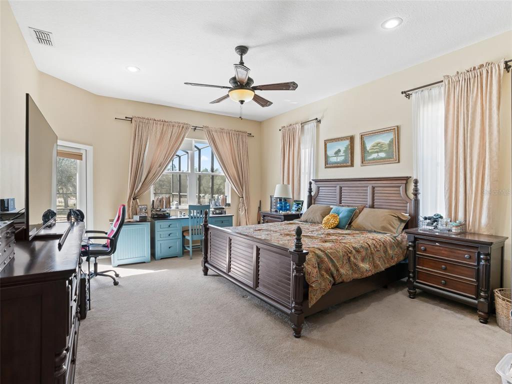 11670 Southeast 6th Street Williston, FL 32696 - Photo 20 of 63 a bed room with a bed and a chandelier