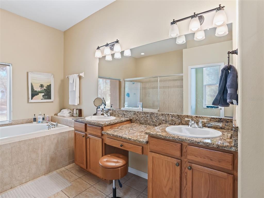 11670 Southeast 6th Street Williston, FL 32696 - Photo 23 of 63 a bathroom with a sink double vanity and a mirror