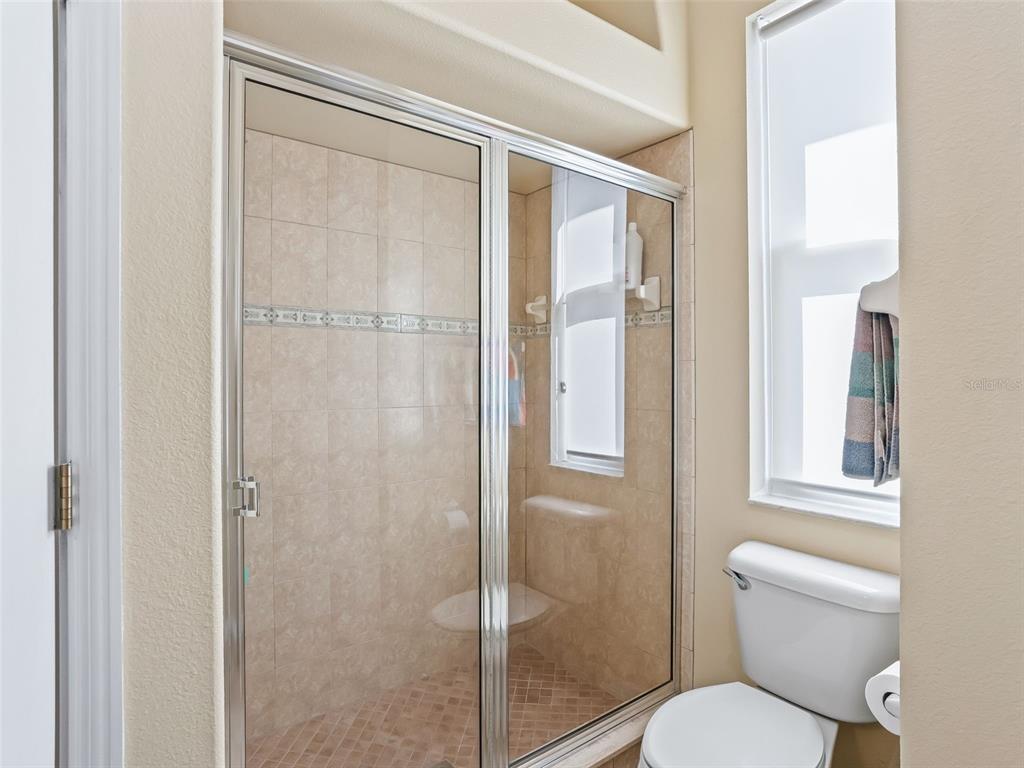 11670 Southeast 6th Street Williston, FL 32696 - Photo 32 of 63 a bathroom with a toilet and a shower