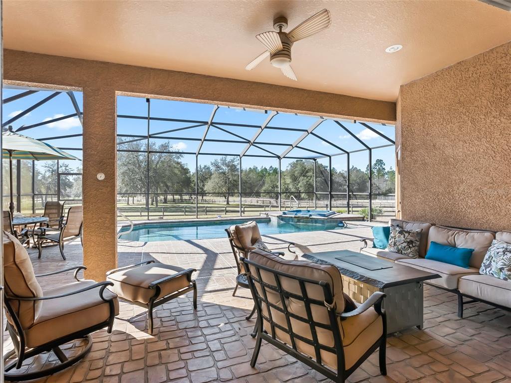 11670 Southeast 6th Street Williston, FL 32696 - Photo 35 of 63 a outdoor living space with furniture and a garden