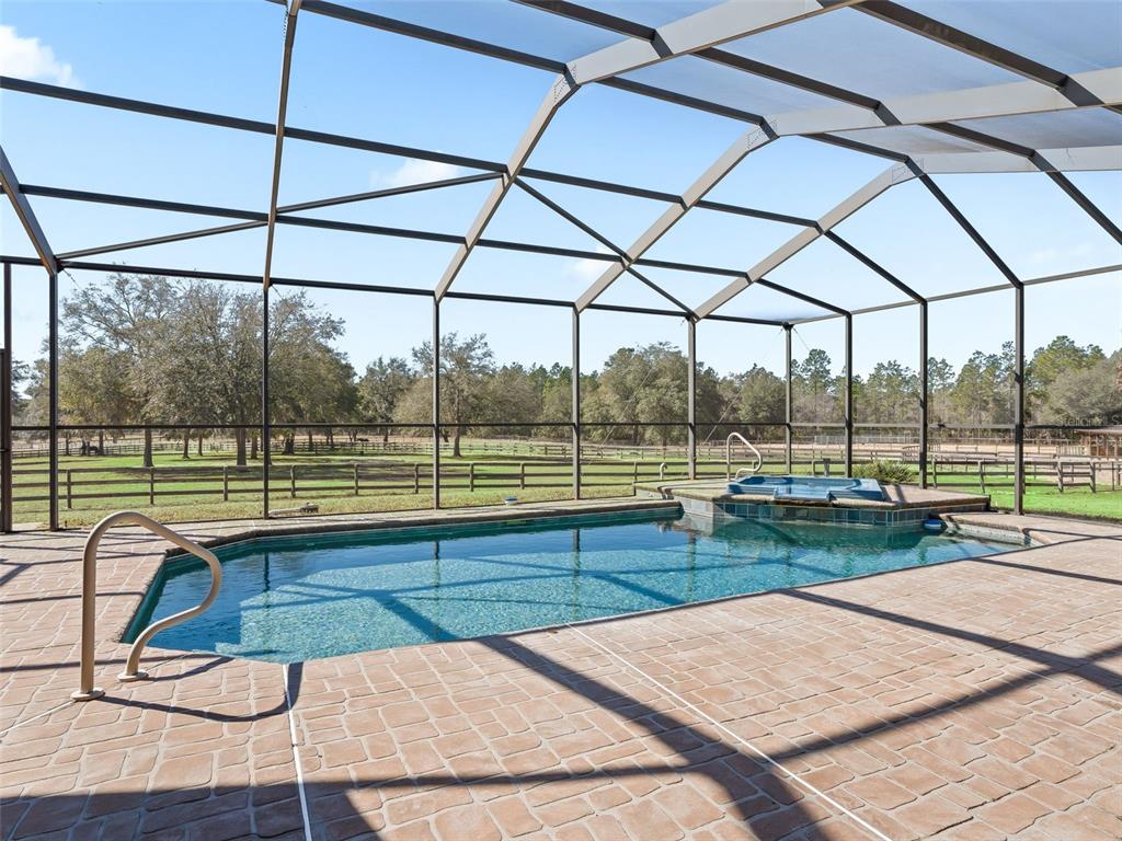 11670 Southeast 6th Street Williston, FL 32696 - Photo 36 of 63 a view of a swimming pool with a porch