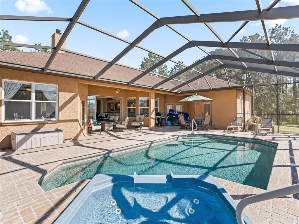 11670 Southeast 6th Street Williston, FL 32696 - Photo 39 of 63 a view of a swimming pool with a patio