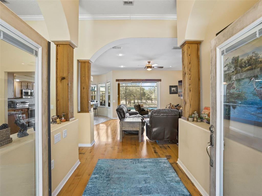 11670 Southeast 6th Street Williston, FL 32696 - Photo 5 of 63 a living room with furniture and a wooden floor