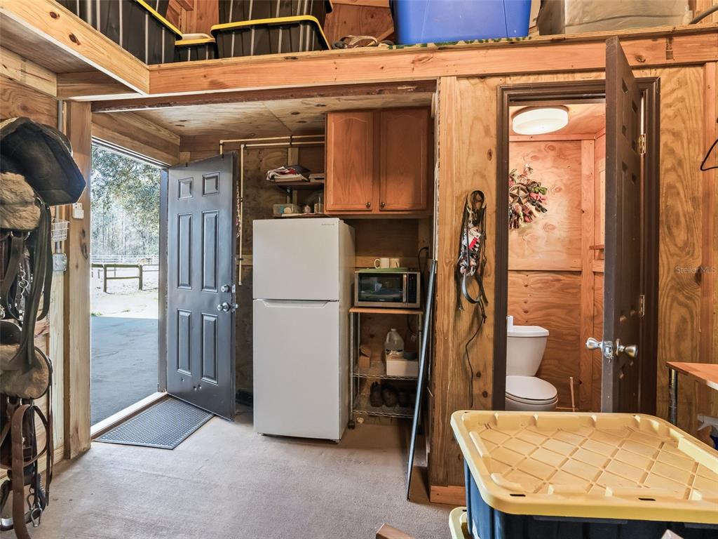 11670 Southeast 6th Street Williston, FL 32696 - Photo 51 of 63 a view of a hallway with a dining table and chairs