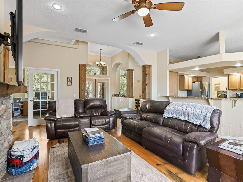 11670 Southeast 6th Street Williston, FL 32696 - Photo 10 of 63 a living room with furniture and wooden floor