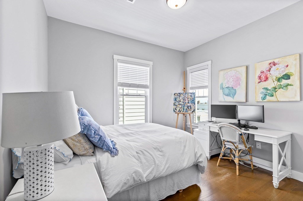 241 Lexington Street, Unit 2 Boston, MA 02128 - Photo 12 of 21 a bedroom with a bed and a desk