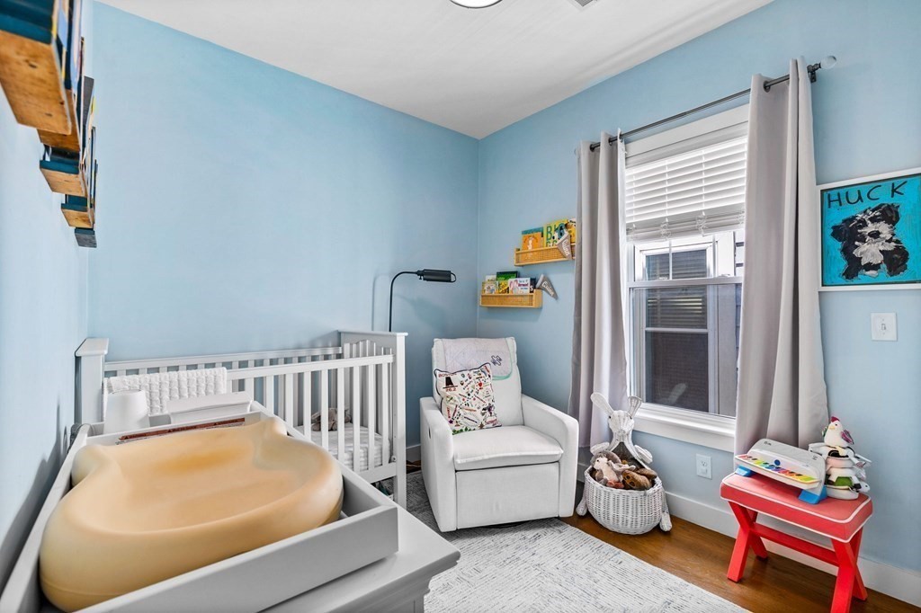 241 Lexington Street, Unit 2 Boston, MA 02128 - Photo 13 of 21 a bedroom with furniture and a window