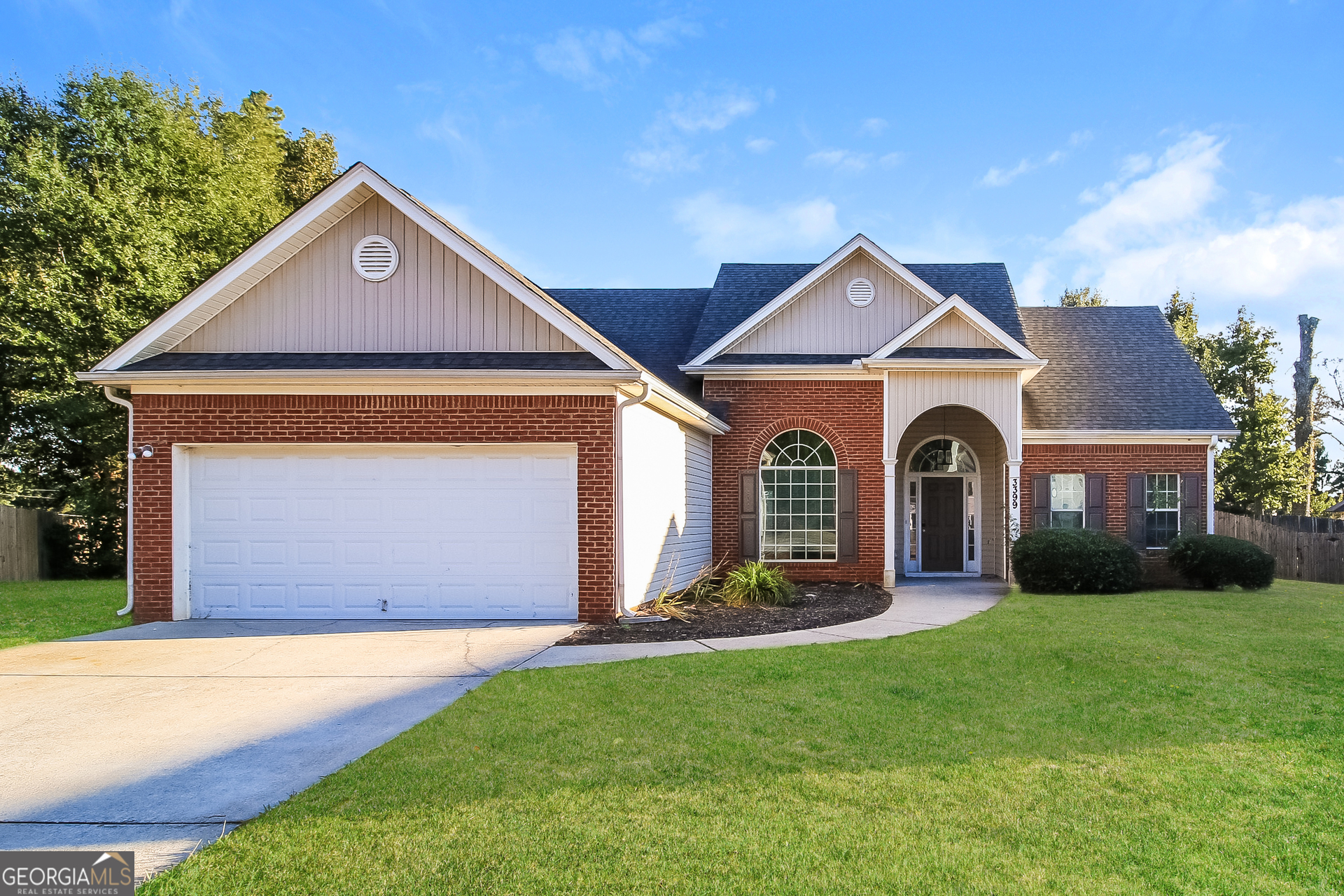 3399 Bells Landing Drive Rex, GA 30273 - Photo 1 of 16 a front view of a house with a yard and garage