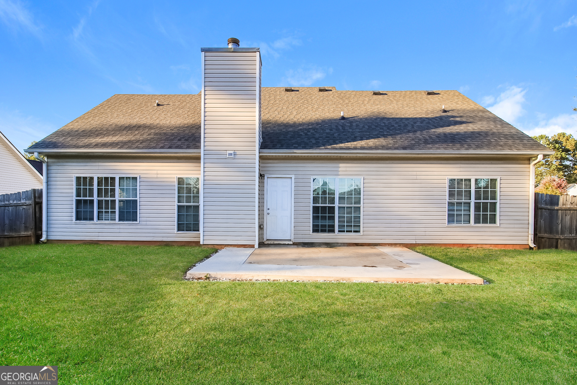 3399 Bells Landing Drive Rex, GA 30273 - Photo 14 of 16 a front view of a house with a yard and garage