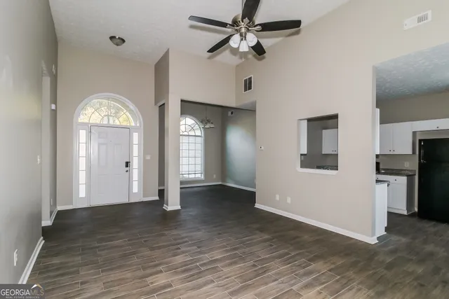 a view of an empty room with a window