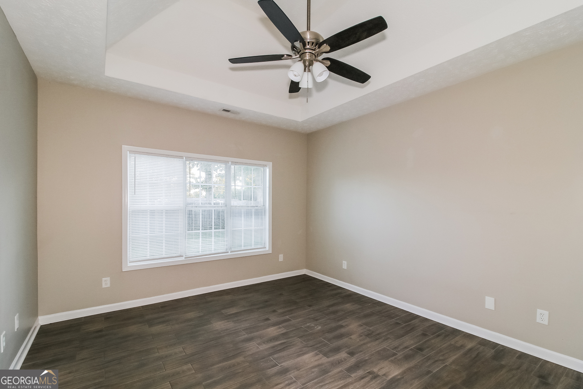3399 Bells Landing Drive Rex, GA 30273 - Photo 8 of 16 an empty room with wooden floor and windows
